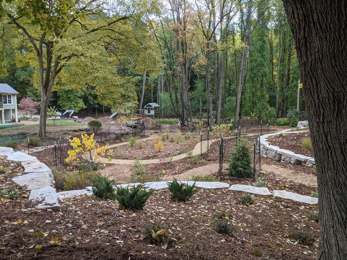 retaining wall and plantings with winding paths
